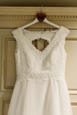 V neckline. Edge softened with lace